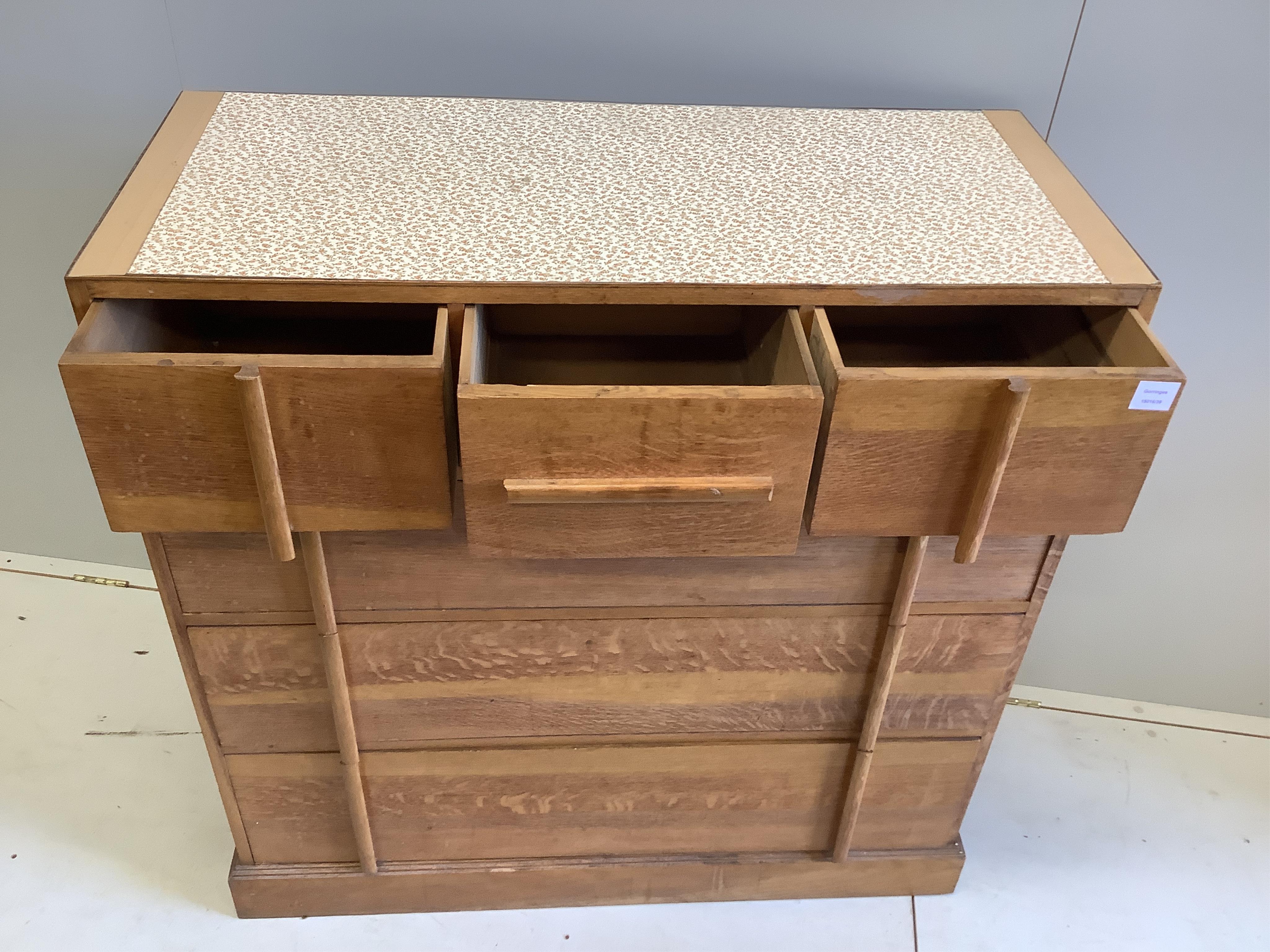 A mid century Heals style oak chest of six drawers with later top, width 106cm, depth 46cm, height 109cm. Condition - poor to fair